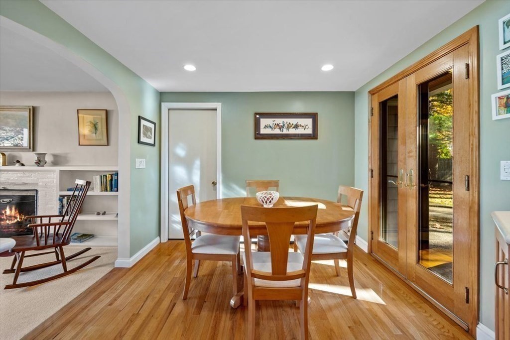 7 Irving Road Natick, MA 01760 - Photo 8 of 39 a view of a dining room with furniture wooden floor and a floor to ceiling window