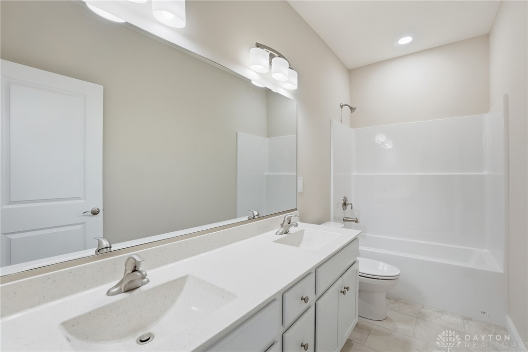4600 Beal Road Franklin, OH 45005 - Photo 24 of 42 Bright, clean bathroom featuring a spacious vanity with dual sinks and a sleek shower-tub combination.