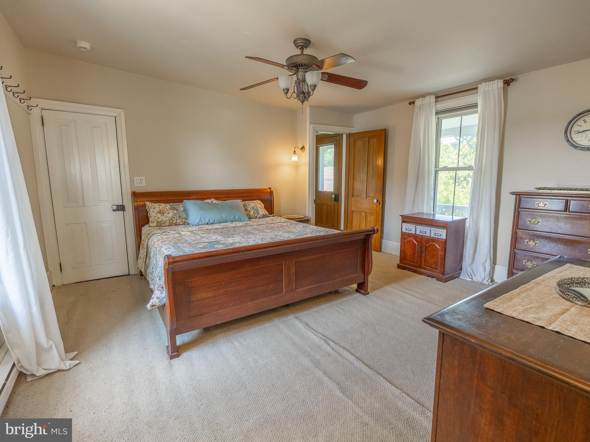 225 Niantic Road Barto, PA 19504 - Photo 52 of 82 a bedroom with a bed and a chandelier