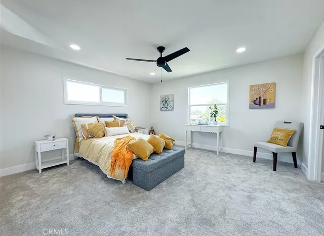 a bed room with a bed and a couch