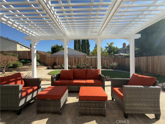 a outdoor living space with patio furniture and a potted plant