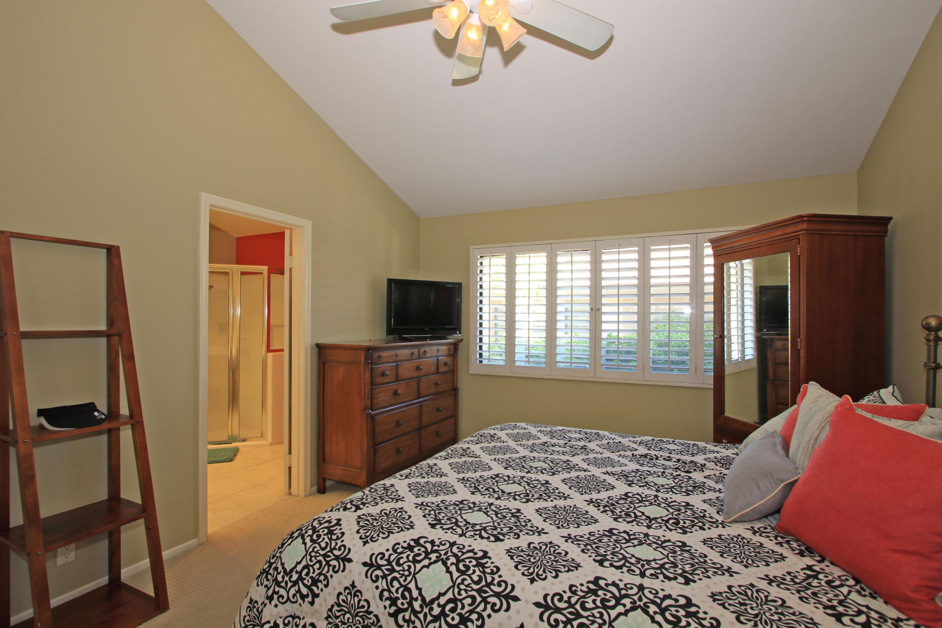 368 Red River Road Palm Desert, CA 92211 - Photo 22 of 36 a bedroom with a bed and a flat screen tv