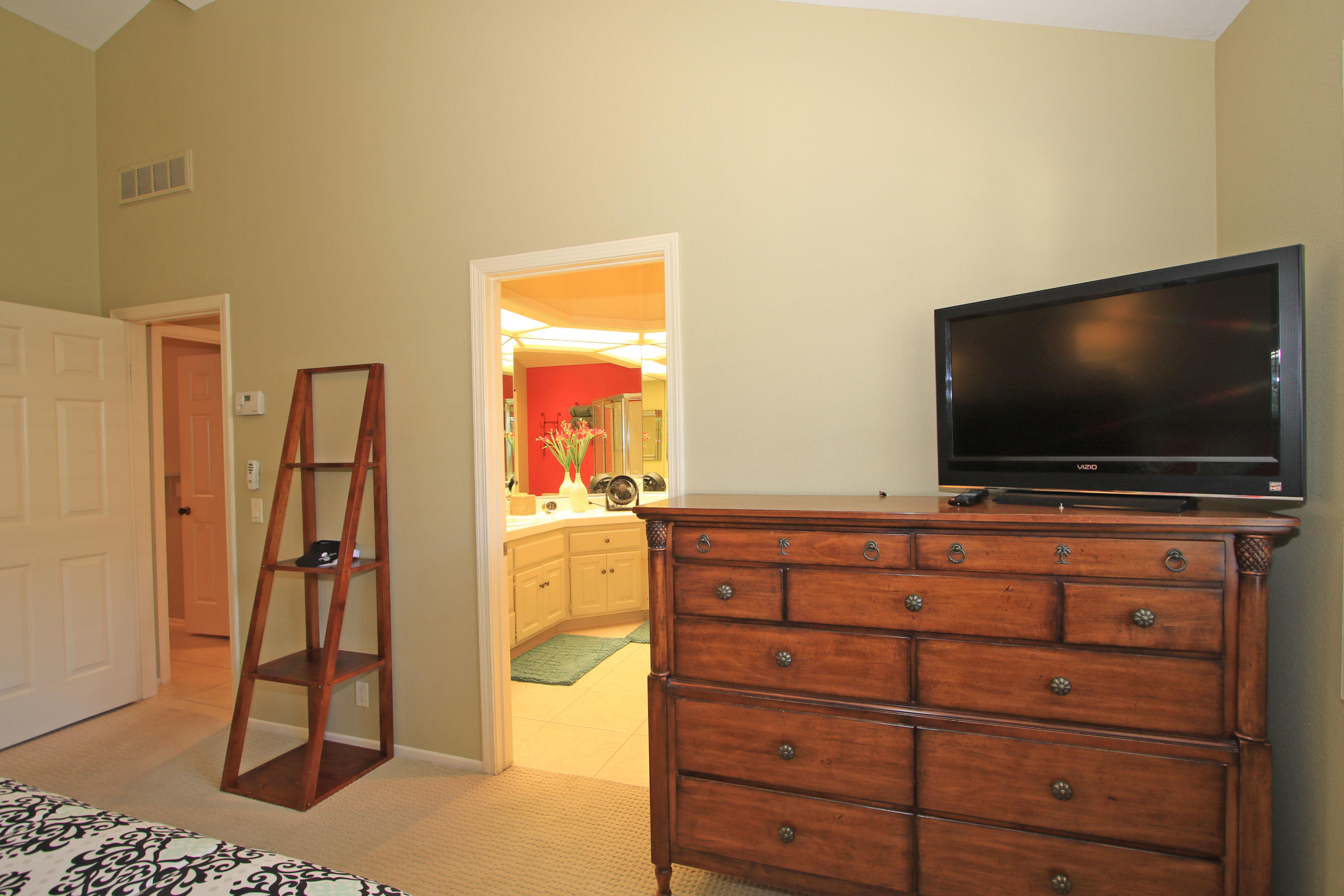 368 Red River Road Palm Desert, CA 92211 - Photo 23 of 36 a living room with furniture and a flat screen tv