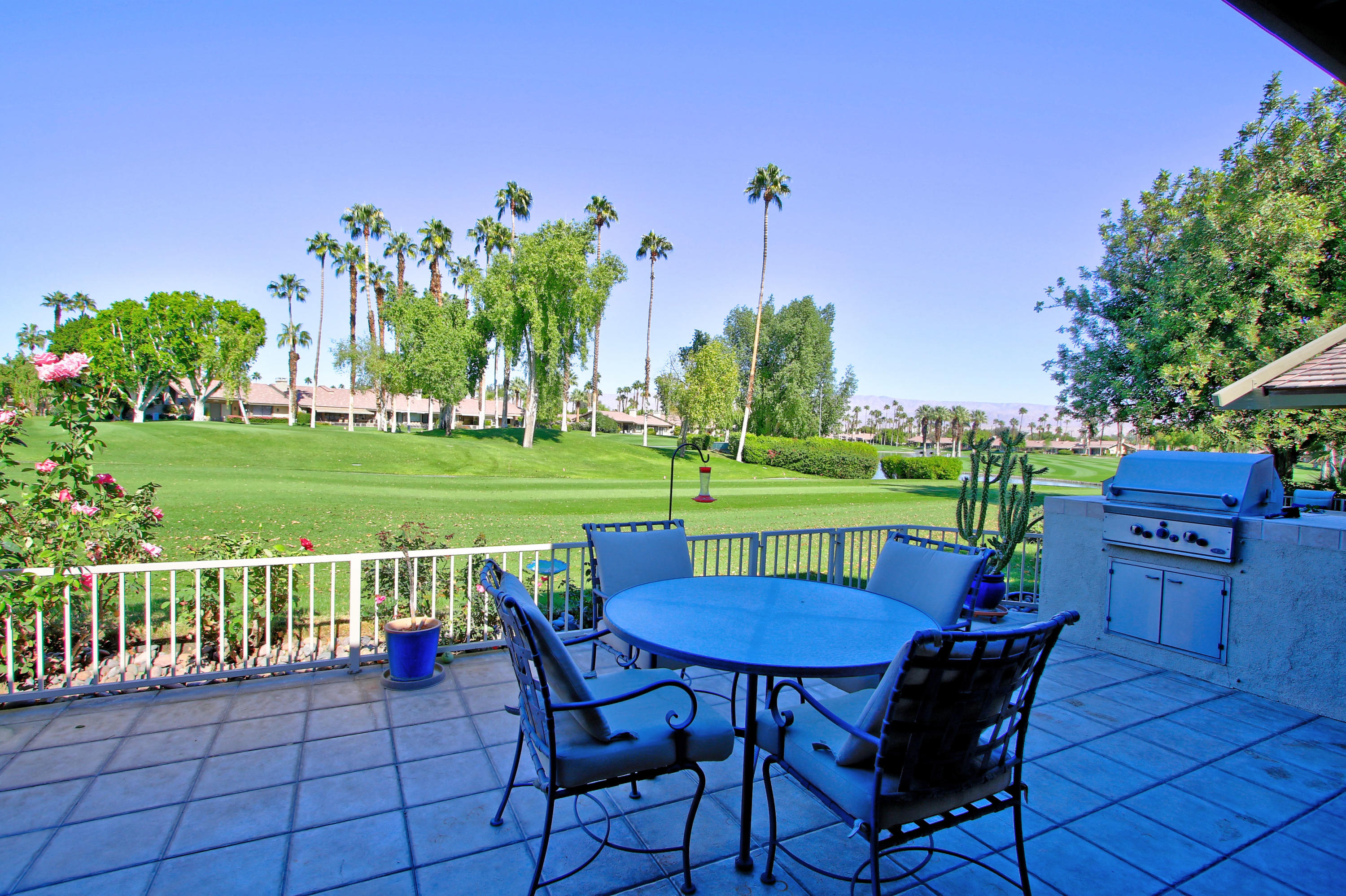 368 Red River Road Palm Desert, CA 92211 - Photo 34 of 36 a view of a chairs and table in the patio