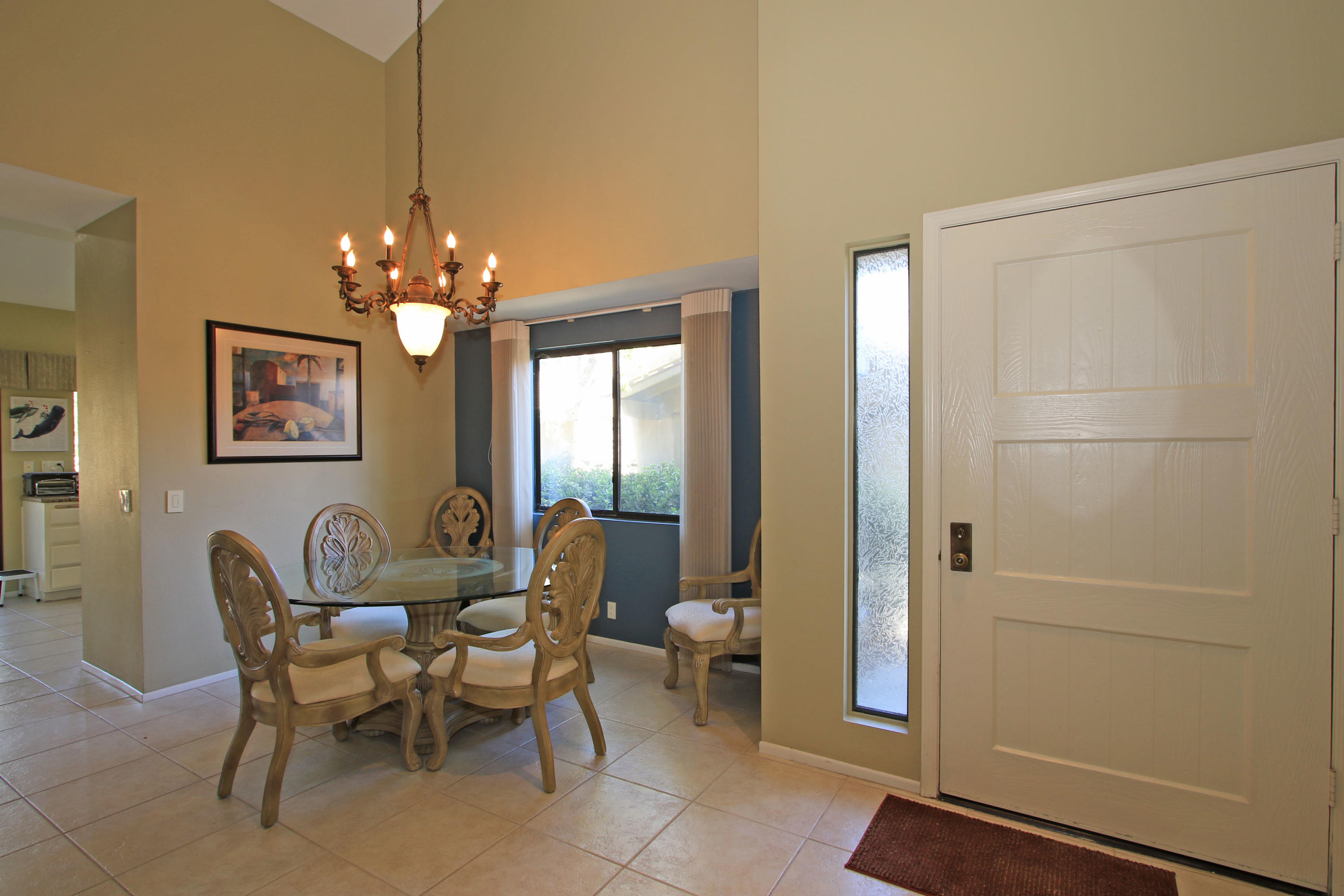 368 Red River Road Palm Desert, CA 92211 - Photo 6 of 36 a view of a dining room with furniture and chandelier