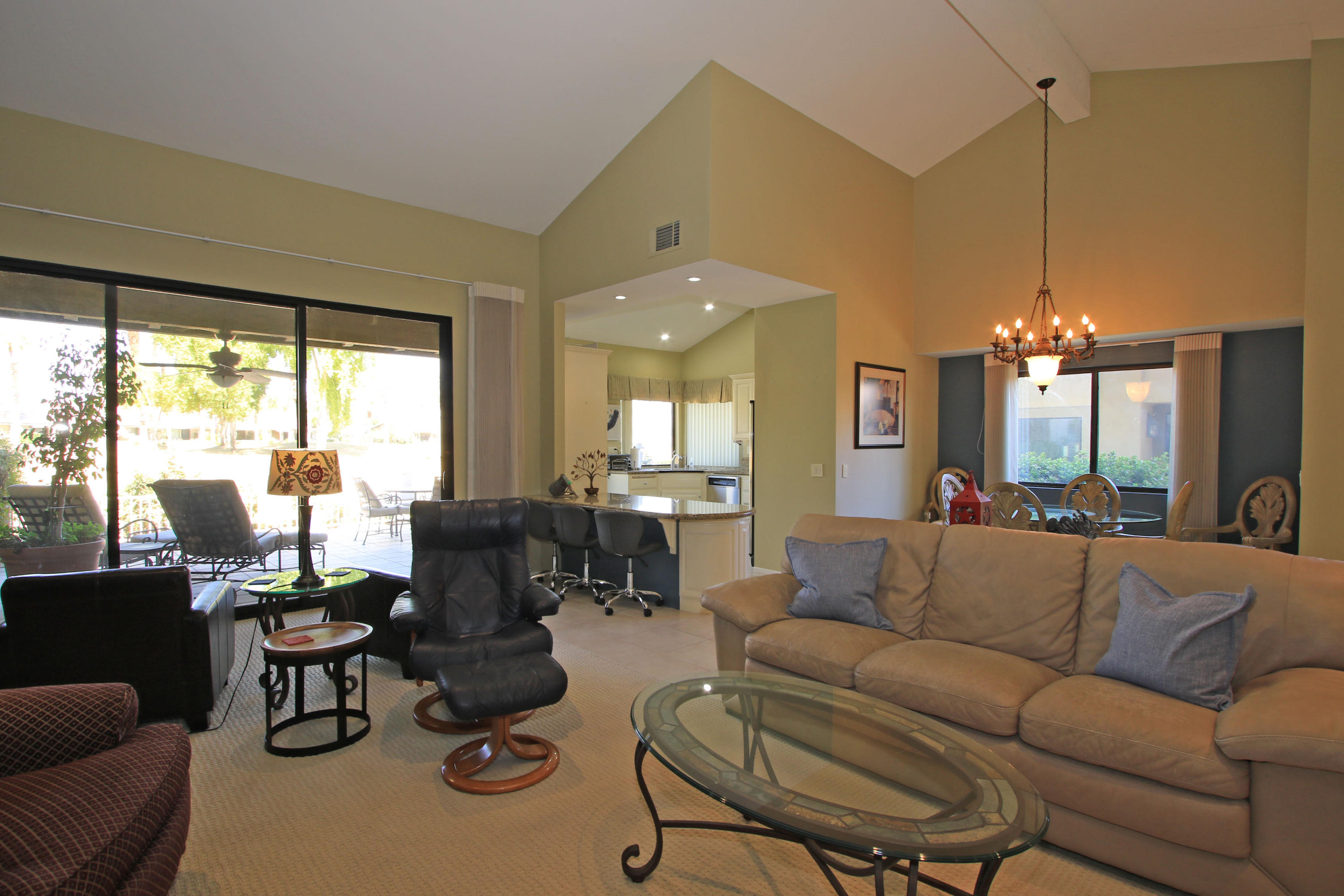368 Red River Road Palm Desert, CA 92211 - Photo 8 of 36 a living room with furniture and a chandelier