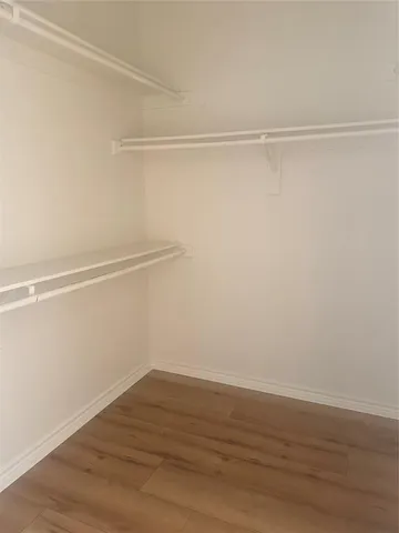 a view of an empty walk in closet
