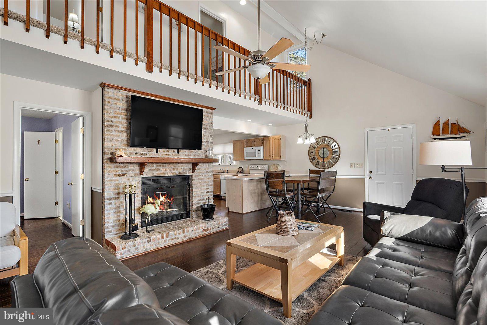 47 Drawbridge Road Ocean Pines, MD 21811 - Photo 15 of 75 a living room with furniture a fireplace and a flat screen tv