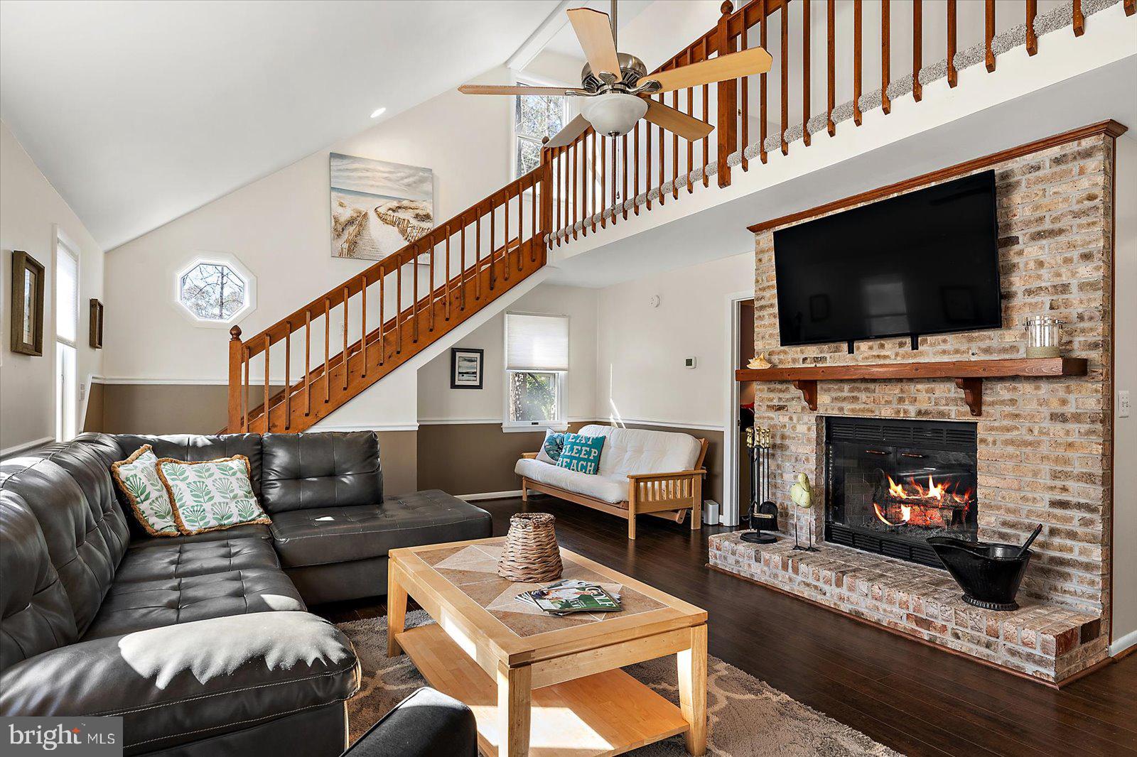 47 Drawbridge Road Ocean Pines, MD 21811 - Photo 17 of 75 a living room with furniture a flat screen tv and a fireplace