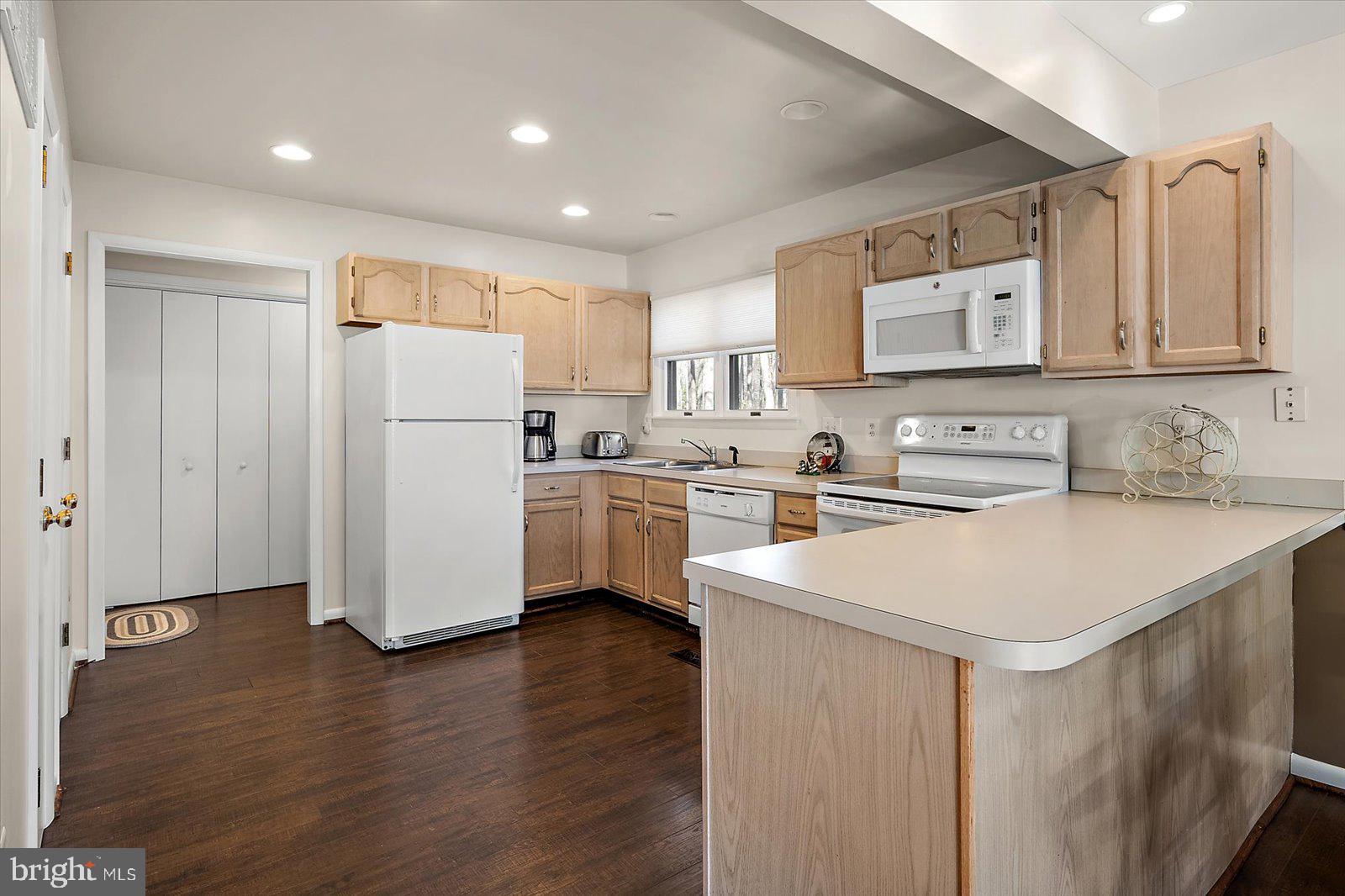 47 Drawbridge Road Ocean Pines, MD 21811 - Photo 20 of 75 a kitchen with a refrigerator a sink and a microwave