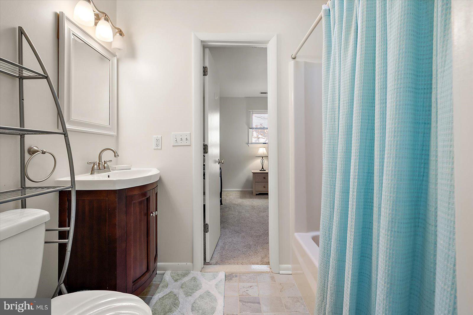 47 Drawbridge Road Ocean Pines, MD 21811 - Photo 32 of 75 a bathroom with a sink a toilet a mirror and shower