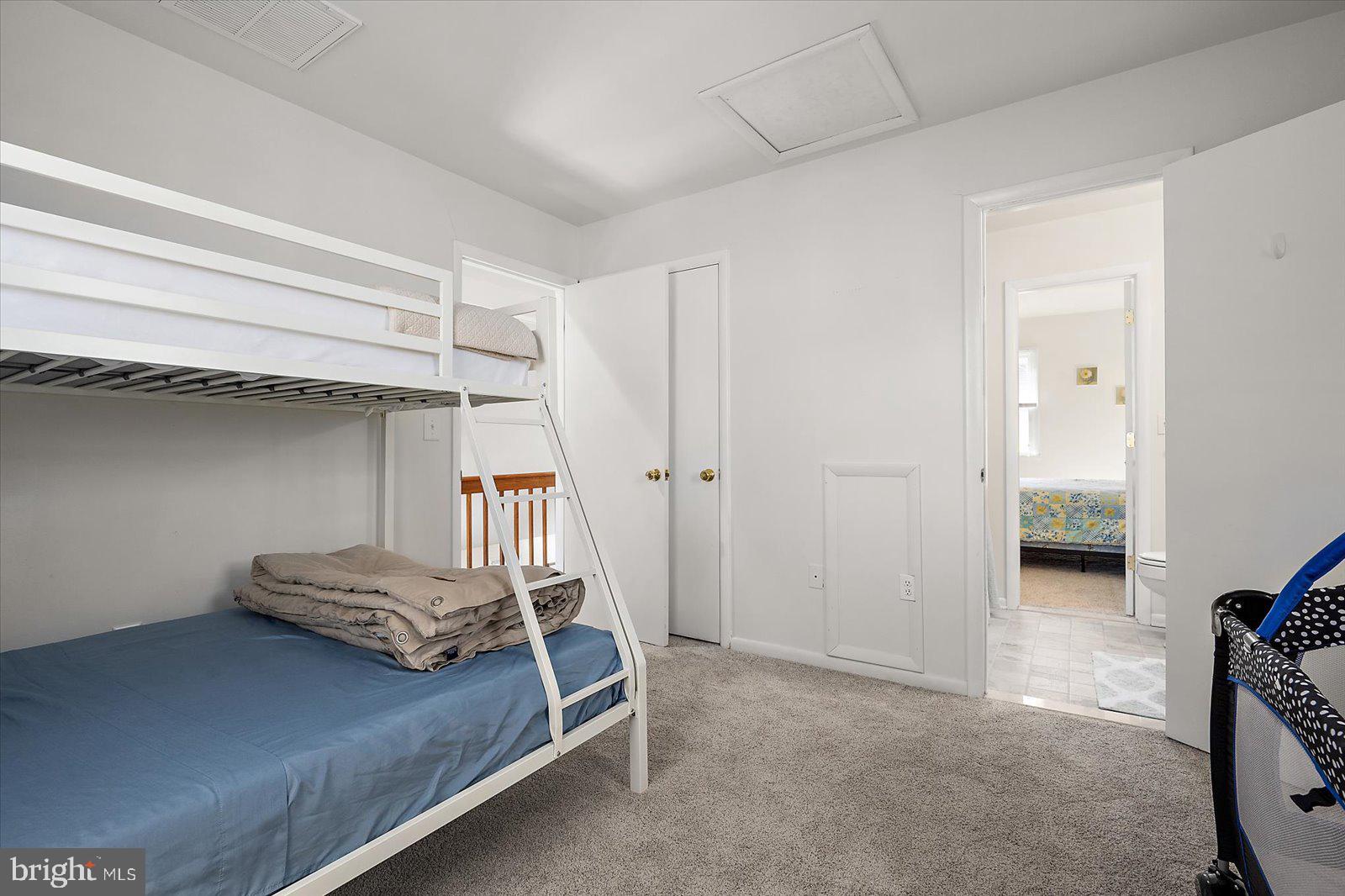 47 Drawbridge Road Ocean Pines, MD 21811 - Photo 36 of 75 a bedroom with a bed and a cabinets