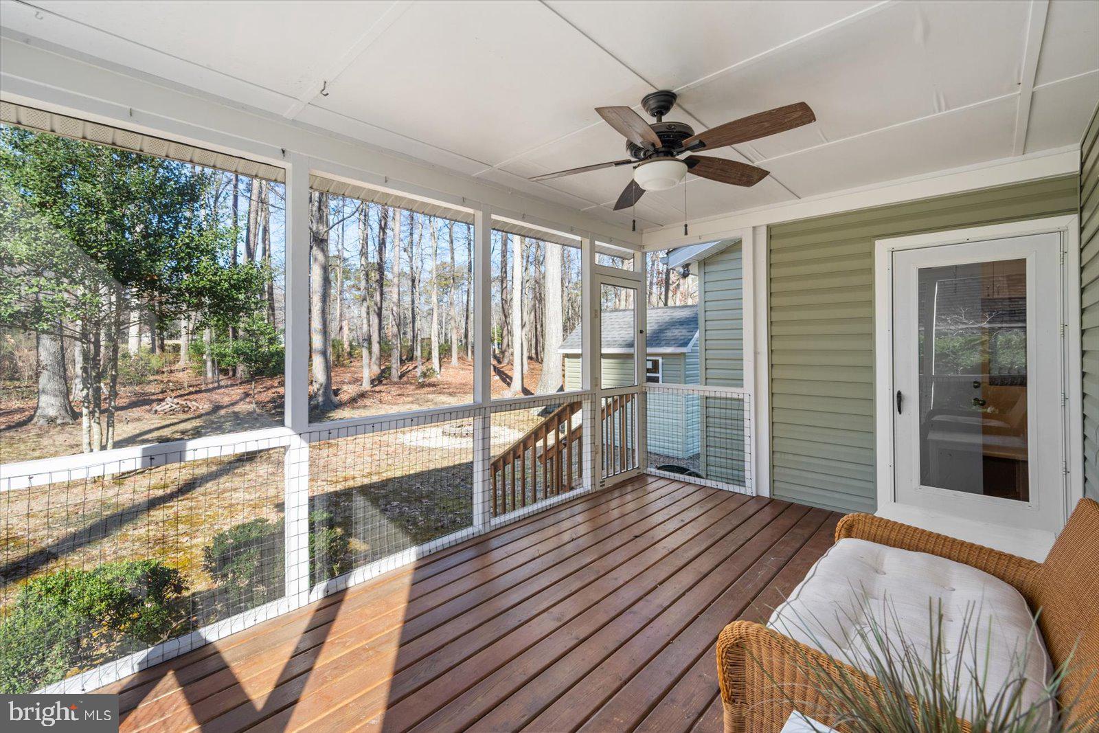 47 Drawbridge Road Ocean Pines, MD 21811 - Photo 41 of 75 a bedroom with a bed and a large window with balcony view