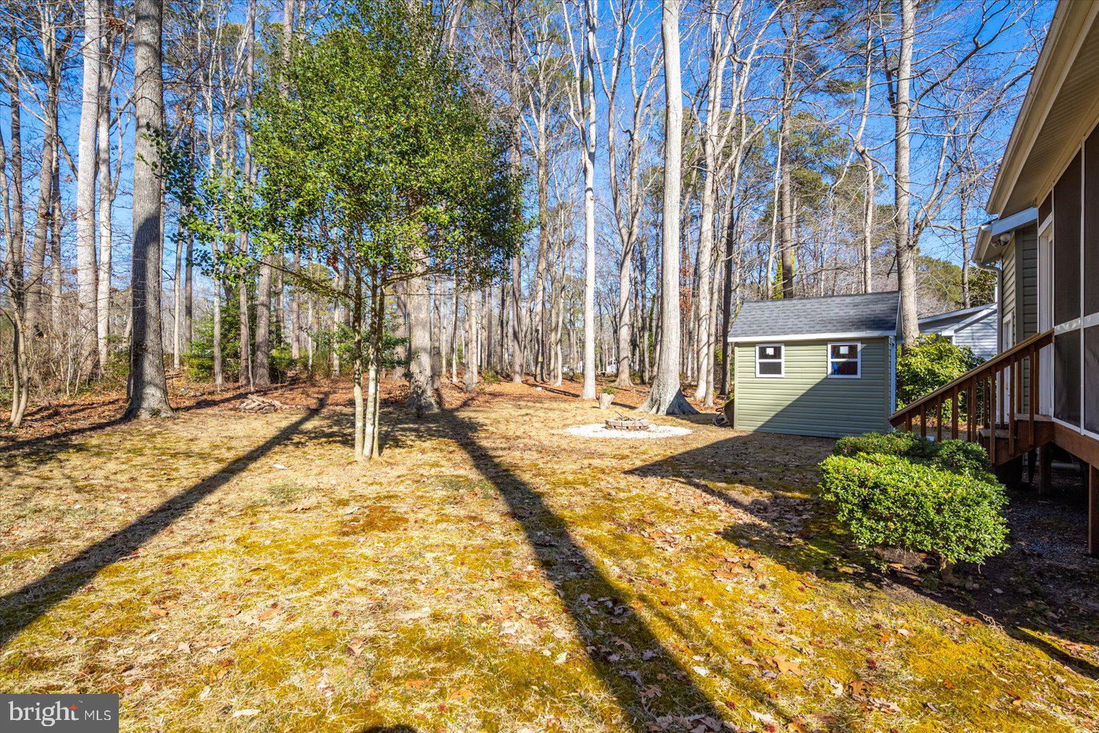 47 Drawbridge Road Ocean Pines, MD 21811 - Photo 46 of 75 a backyard of a house with lots of green space