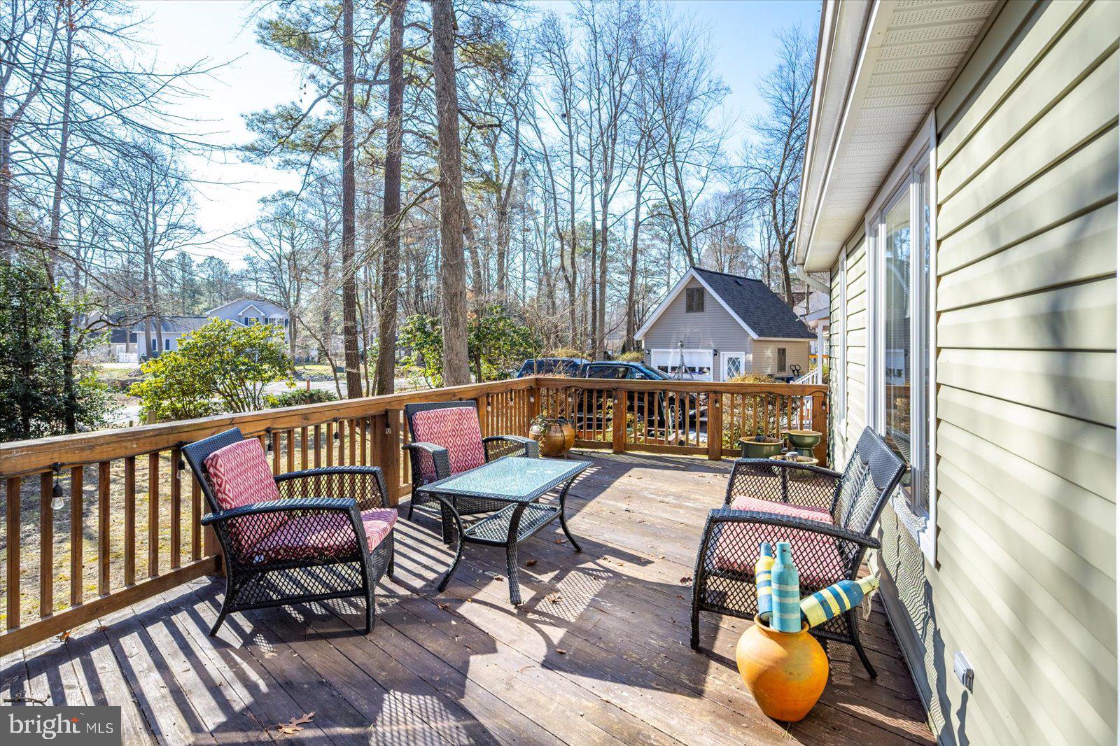 47 Drawbridge Road Ocean Pines, MD 21811 - Photo 7 of 75 a view of a wooden chairs and bench on the roof deck