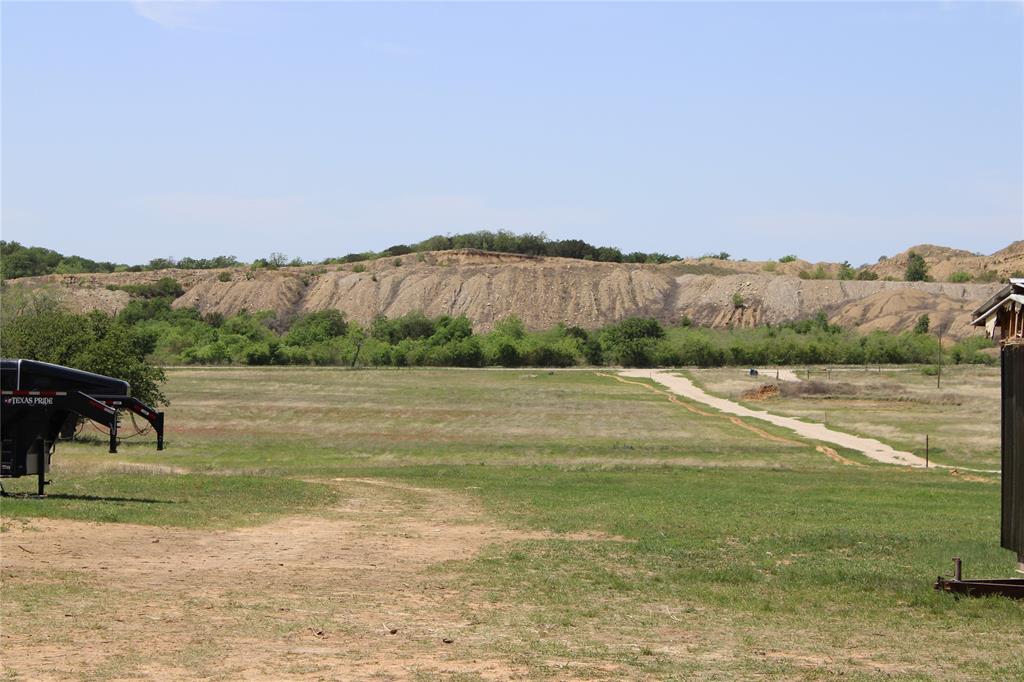 1650 County Road 119 Gordon, TX 76453 - Photo 2 of 15 a view of a lake with a yard