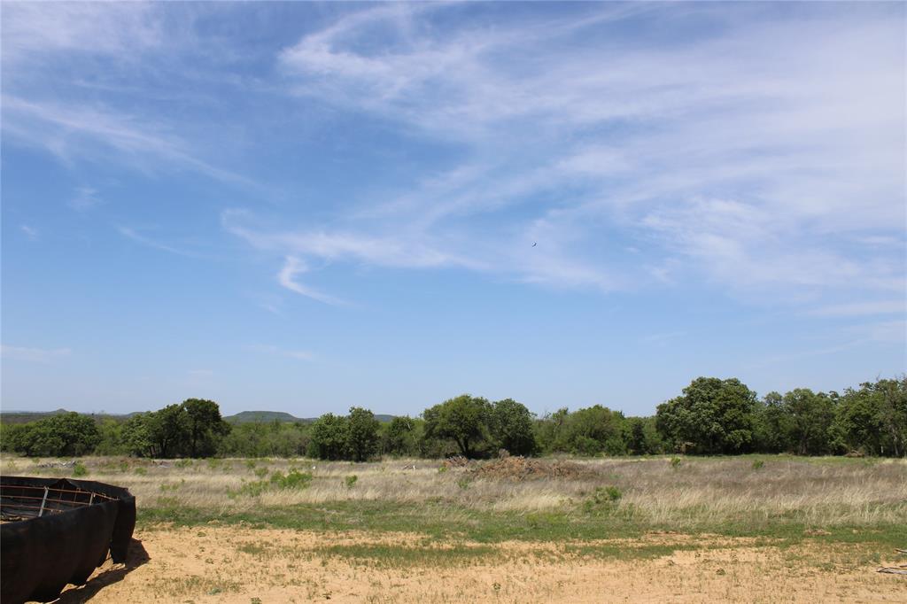 1650 County Road 119 Gordon, TX 76453 - Photo 9 of 15 a view of a lake with houses in the back