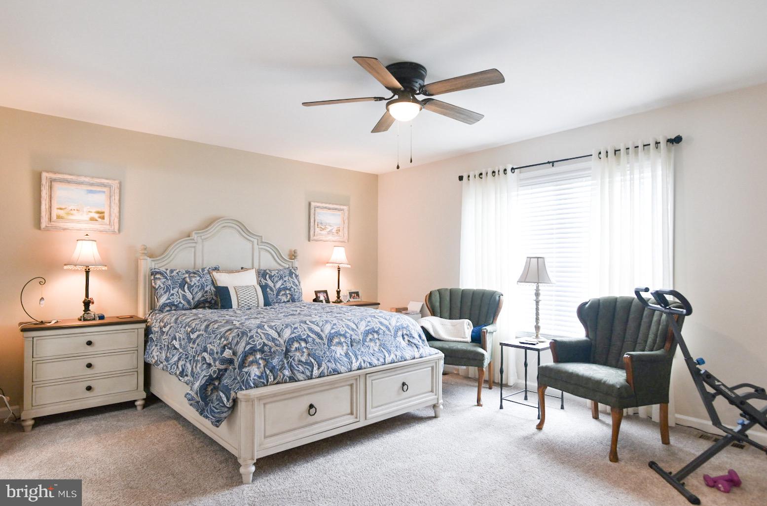 33510 Deer Run Road Frankford, DE 19945 - Photo 13 of 53 a bedroom with a bed a couch and a window