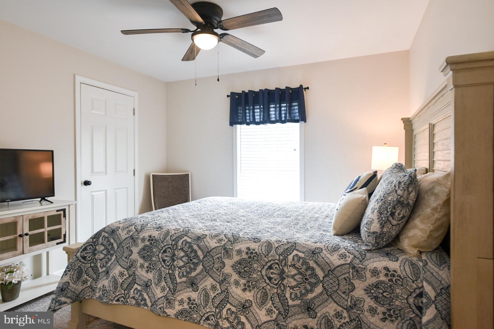33510 Deer Run Road Frankford, DE 19945 - Photo 15 of 53 a bedroom with a bed and a flat screen tv