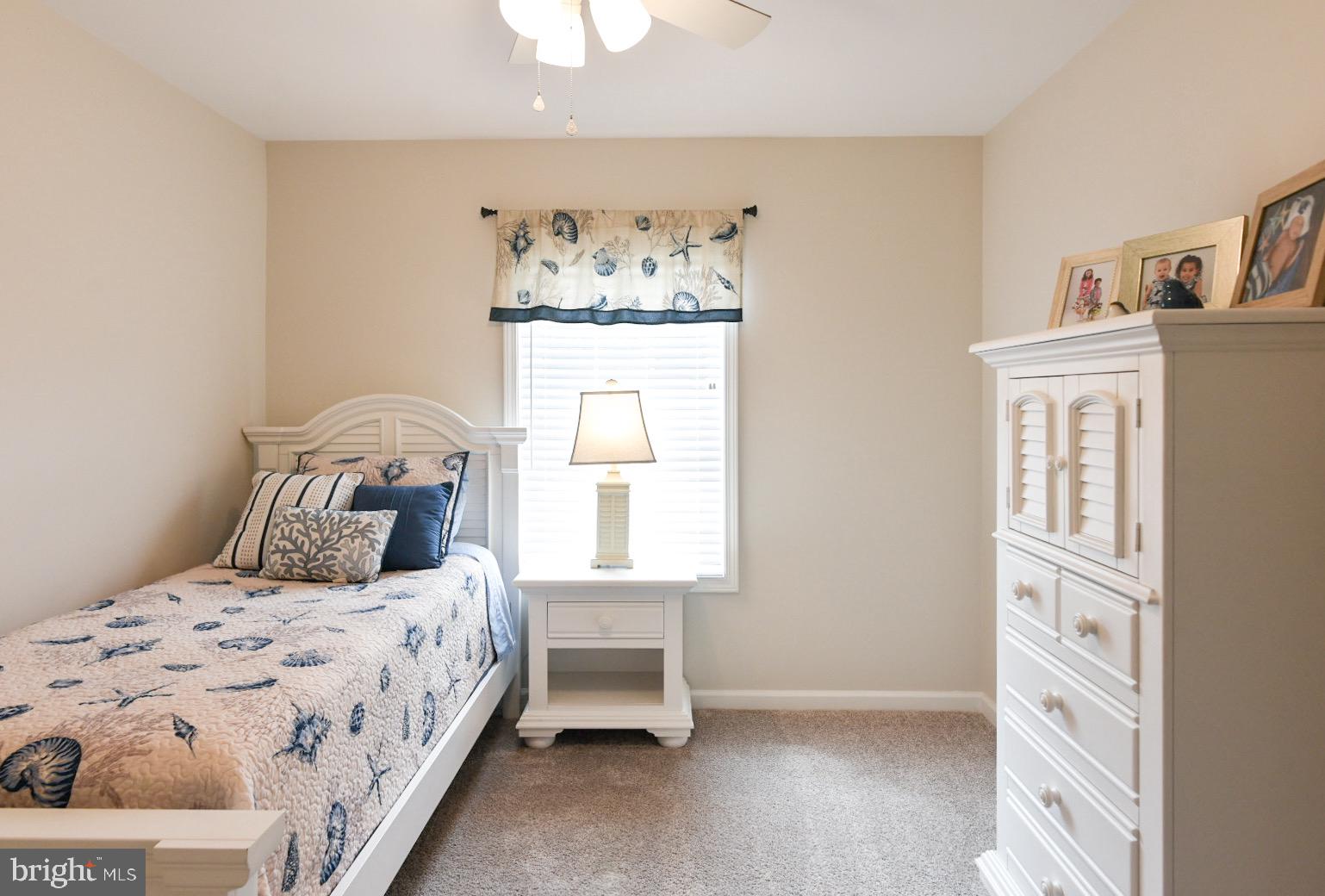 33510 Deer Run Road Frankford, DE 19945 - Photo 16 of 53 a bedroom with a bed and a window