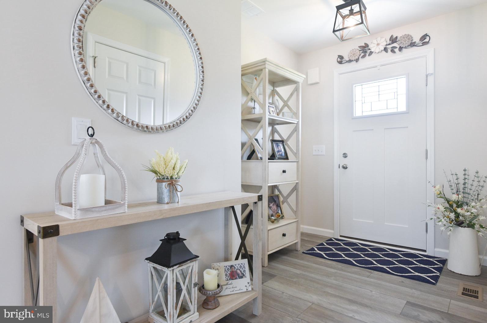 33510 Deer Run Road Frankford, DE 19945 - Photo 28 of 53 a bathroom with a sink a mirror and a shower