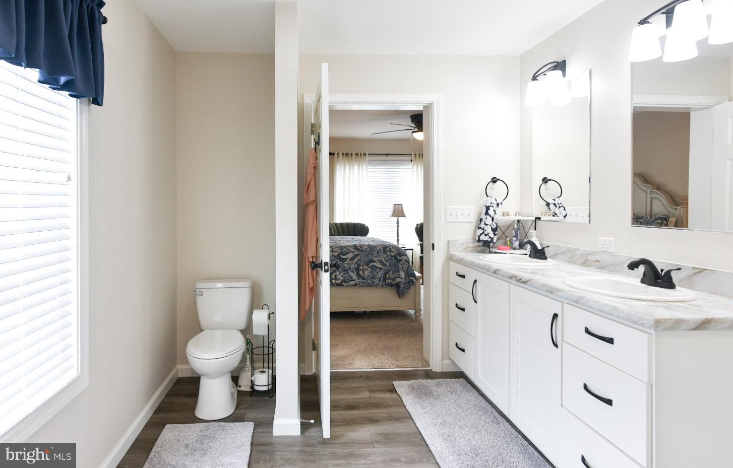 33510 Deer Run Road Frankford, DE 19945 - Photo 40 of 53 a en suite bathroom with a double vanity sink and a mirror