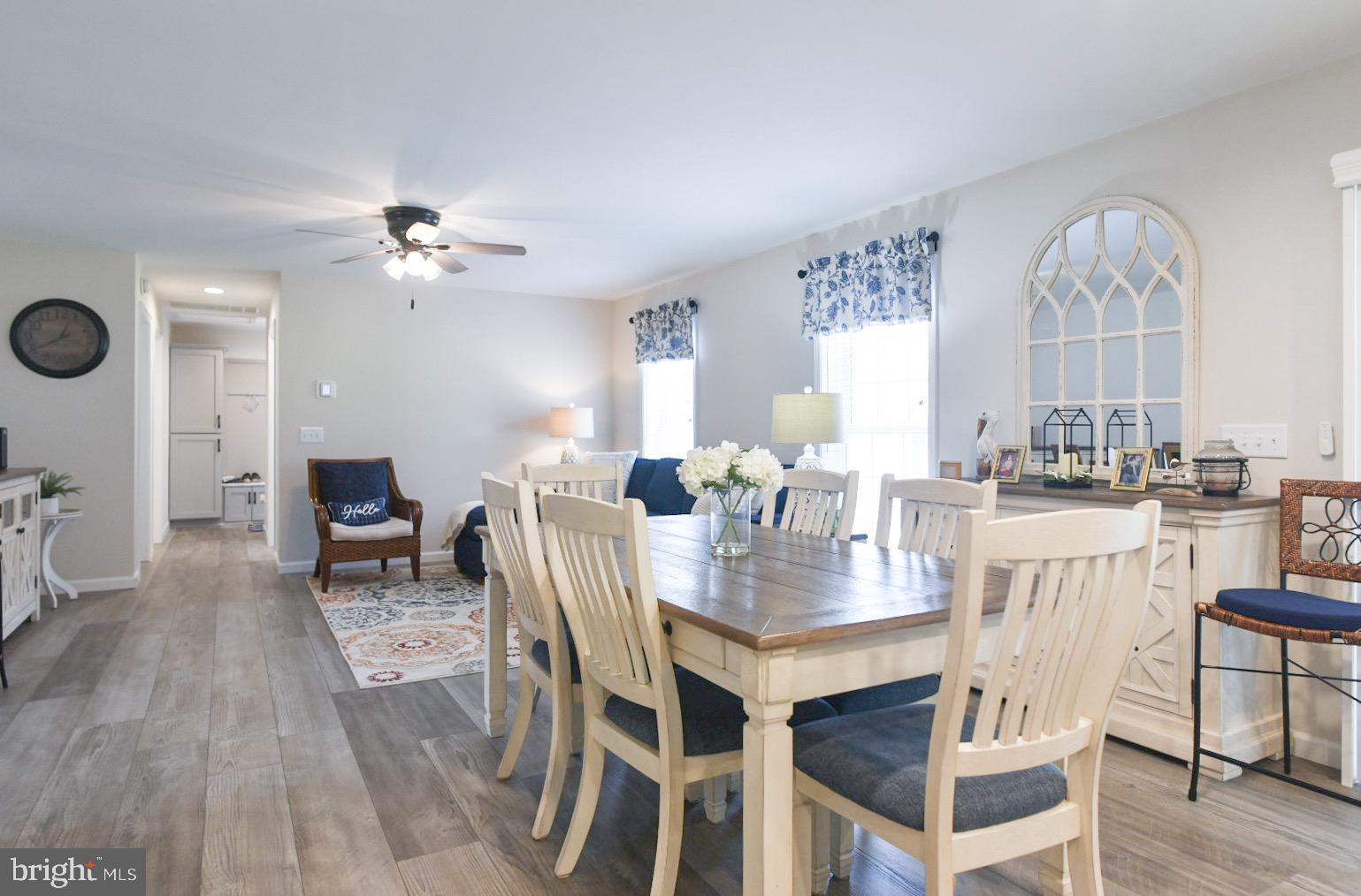 33510 Deer Run Road Frankford, DE 19945 - Photo 4 of 53 a view of a dining room with furniture and wooden floor