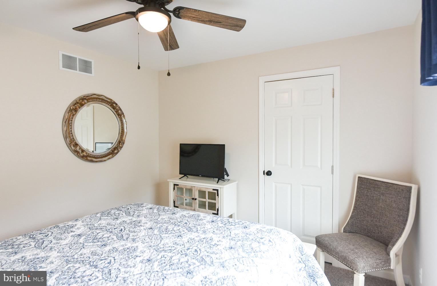 33510 Deer Run Road Frankford, DE 19945 - Photo 43 of 53 a bedroom with a bed and a chair