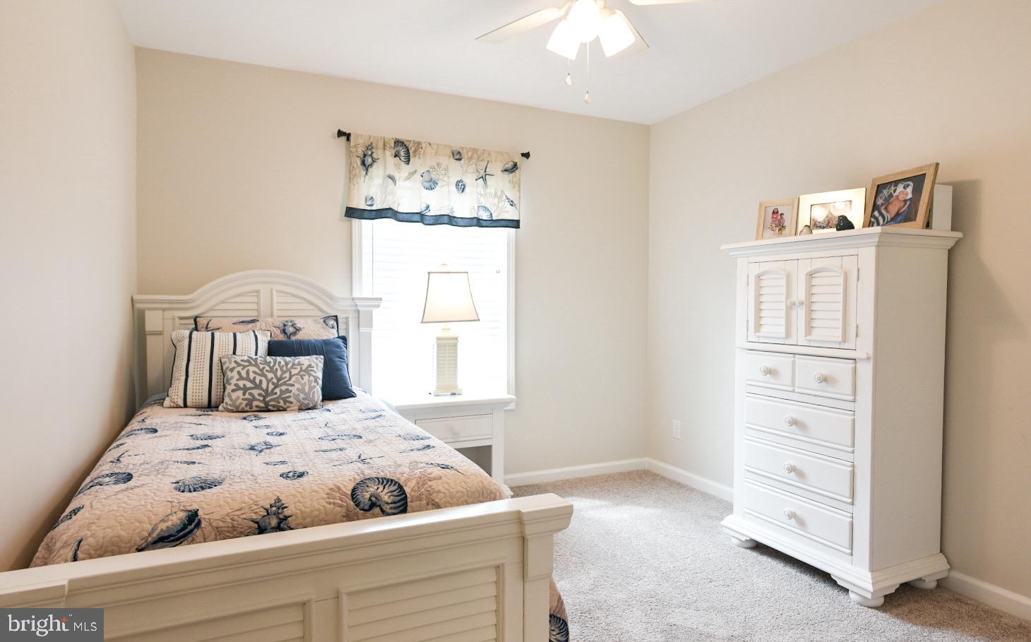 33510 Deer Run Road Frankford, DE 19945 - Photo 45 of 53 a bedroom with a bed and a window