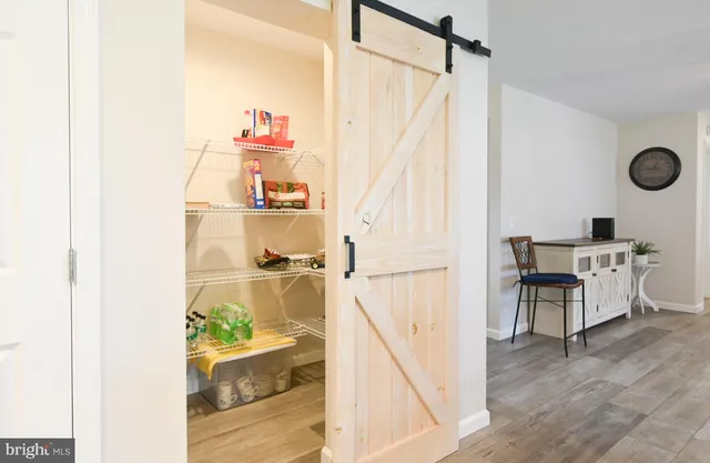 a aerial view of a house with a yard and trees