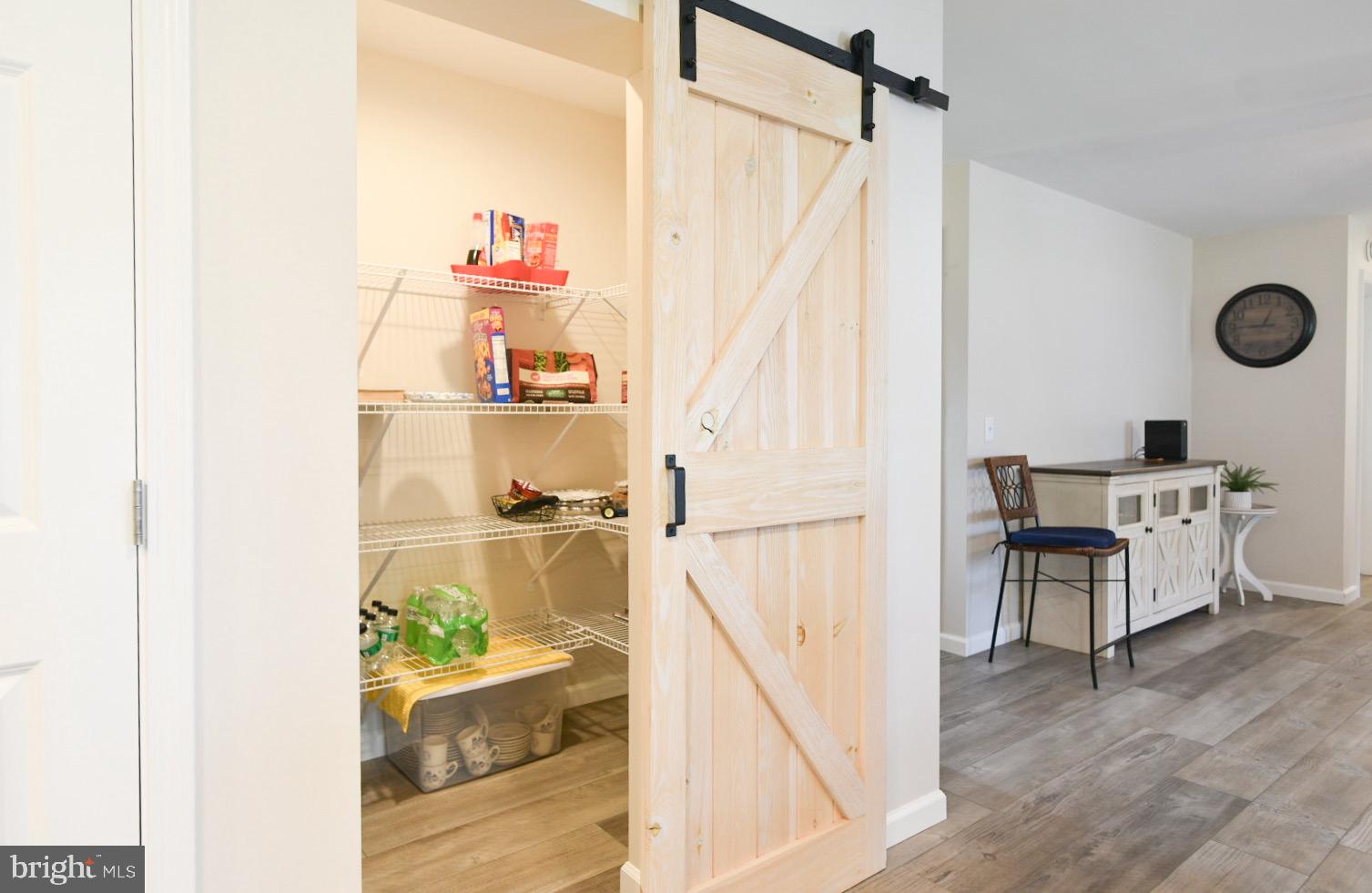 33510 Deer Run Road Frankford, DE 19945 - Photo 7 of 53 a view of a hallway with wooden floor and dining room