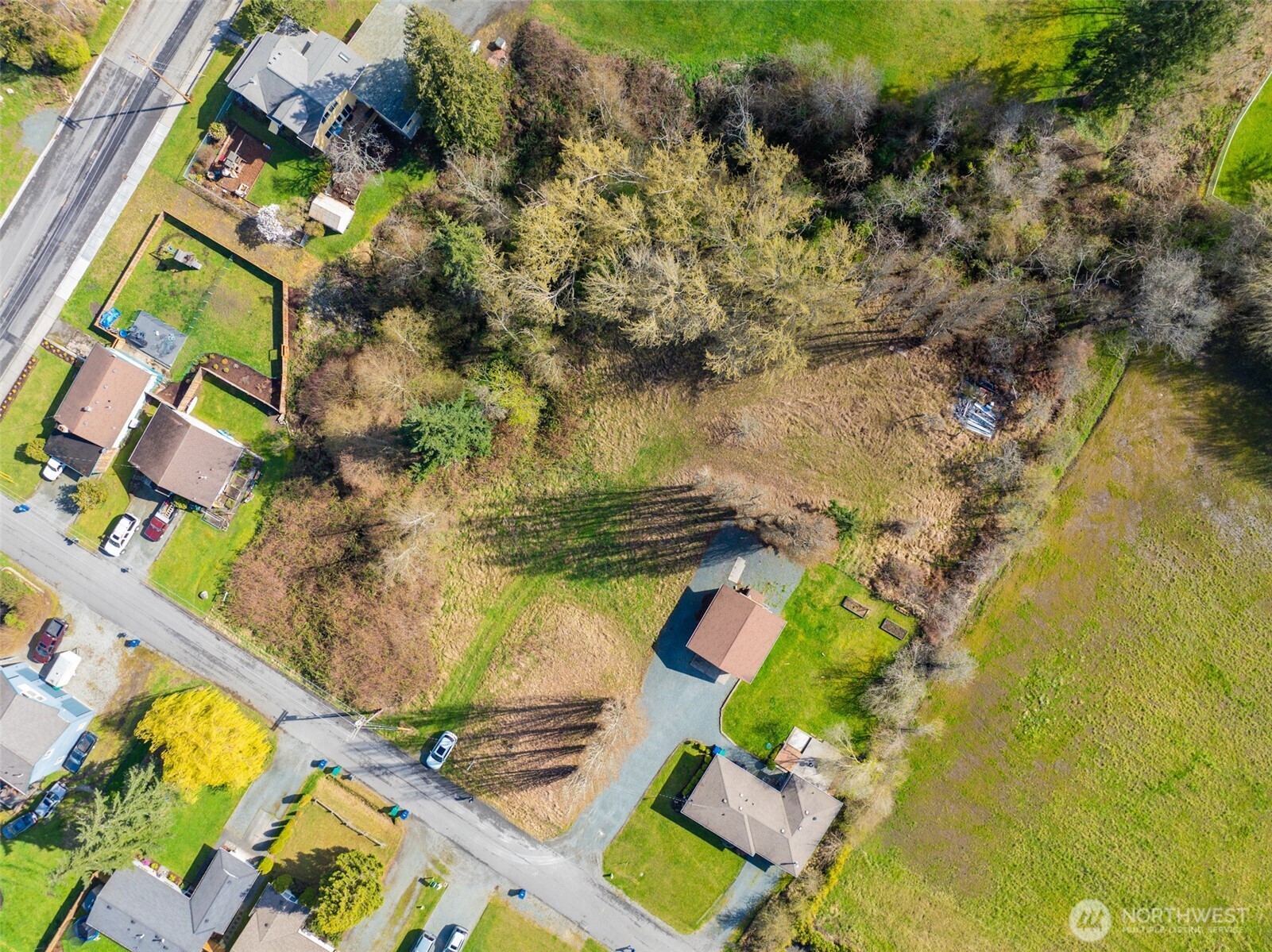 4011 Commercial Avenue Anacortes, WA 98221 - Photo 4 of 10 a aerial view of a house with a yard and lake view