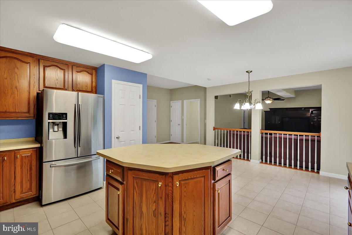 203 Barrington Drive Reading, PA 19607 - Photo 12 of 44 a kitchen with stainless steel appliances a refrigerator and a stove