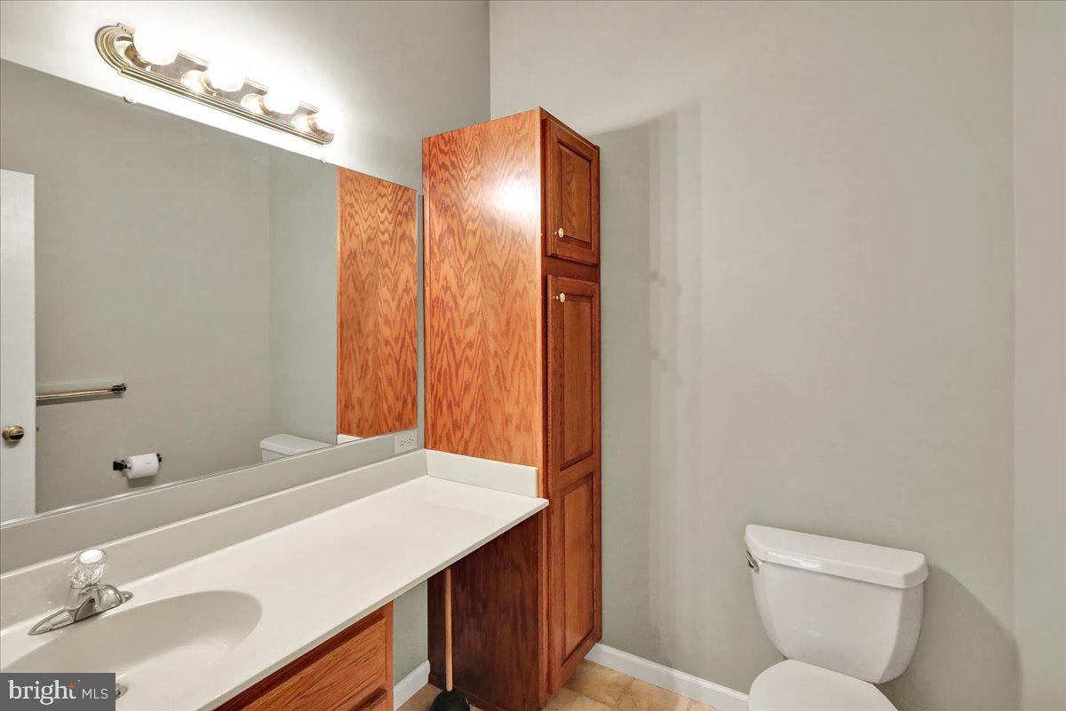 203 Barrington Drive Reading, PA 19607 - Photo 17 of 44 a bathroom with a sink vanity mirror and toilet