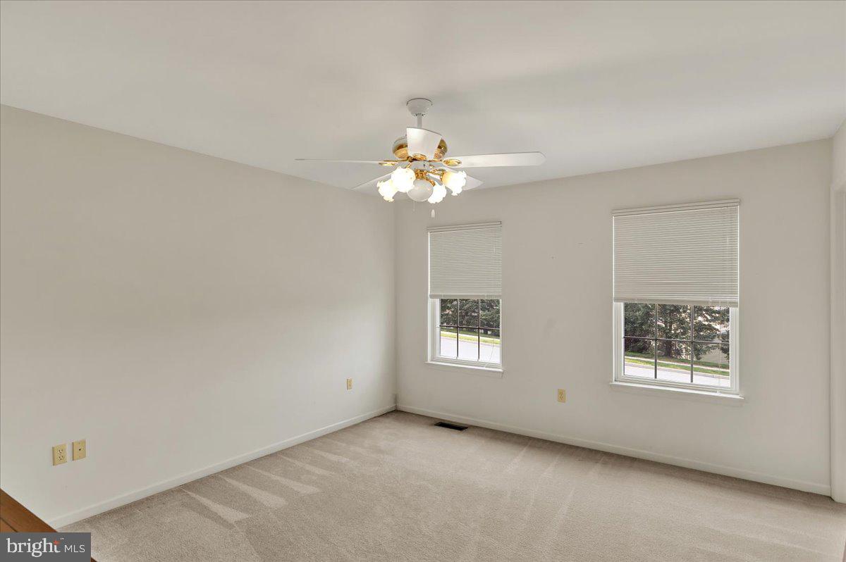 203 Barrington Drive Reading, PA 19607 - Photo 32 of 44 wooden floor in an empty room with a window