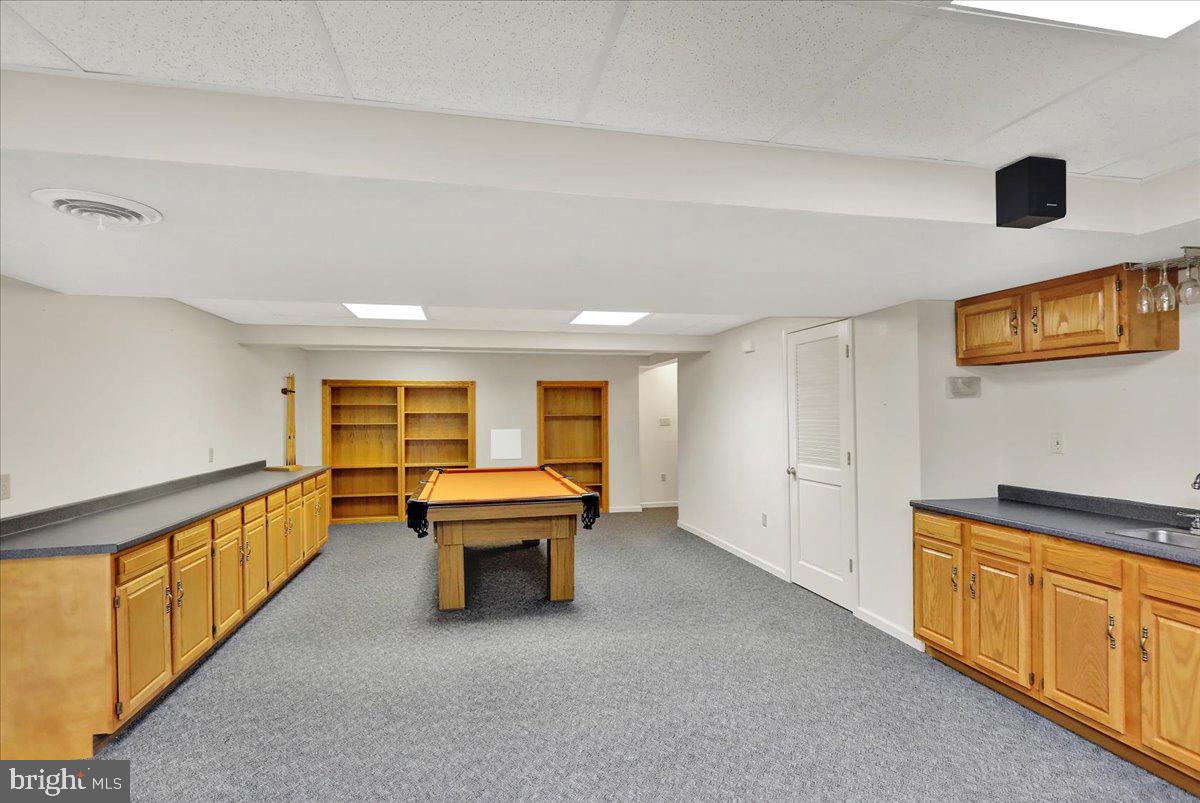 203 Barrington Drive Reading, PA 19607 - Photo 36 of 44 a view of an empty room with furniture wooden floor and windows