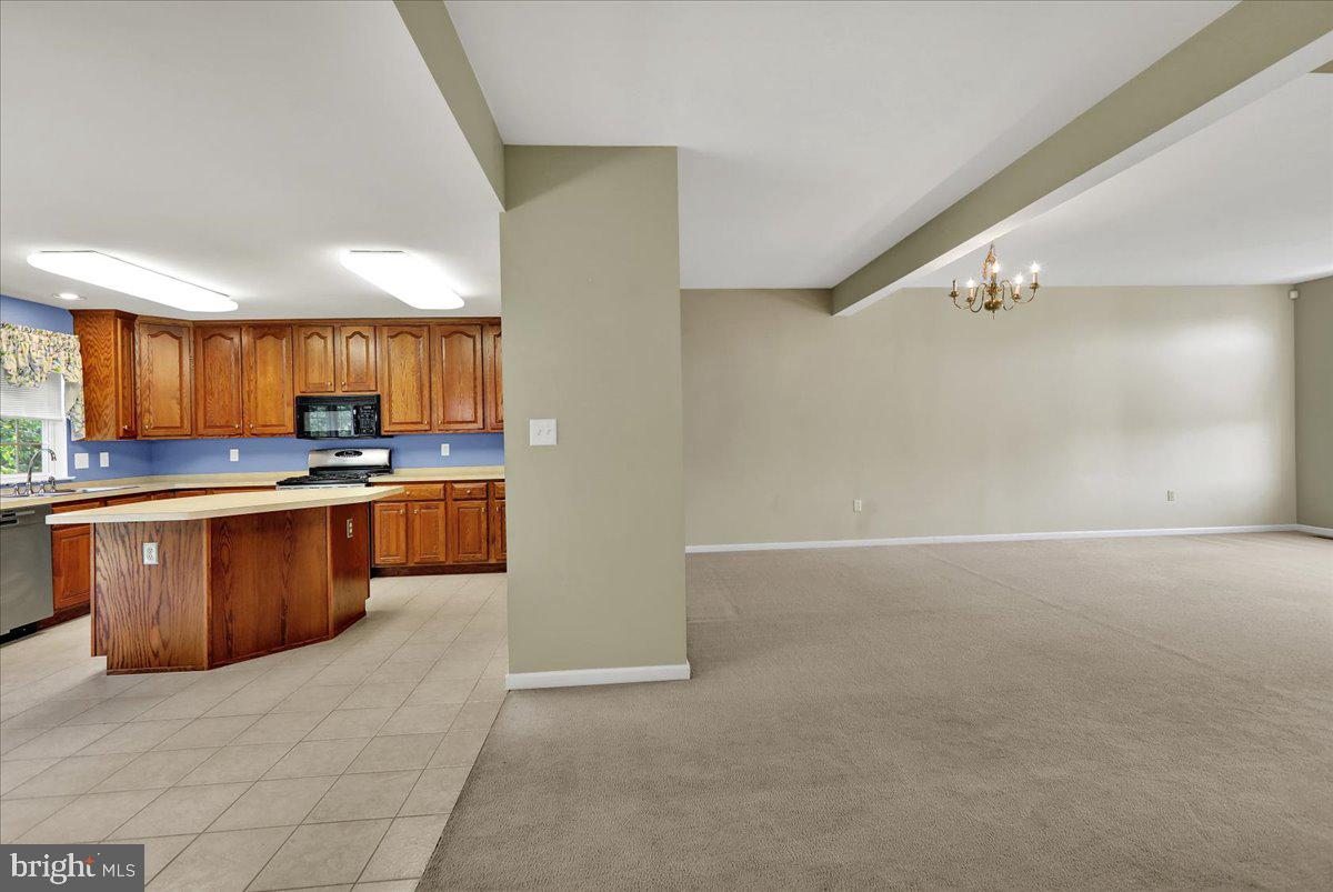 203 Barrington Drive Reading, PA 19607 - Photo 7 of 44 a large kitchen with a large counter top a sink and cabinets