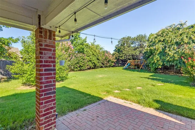 a view of a backyard of a house