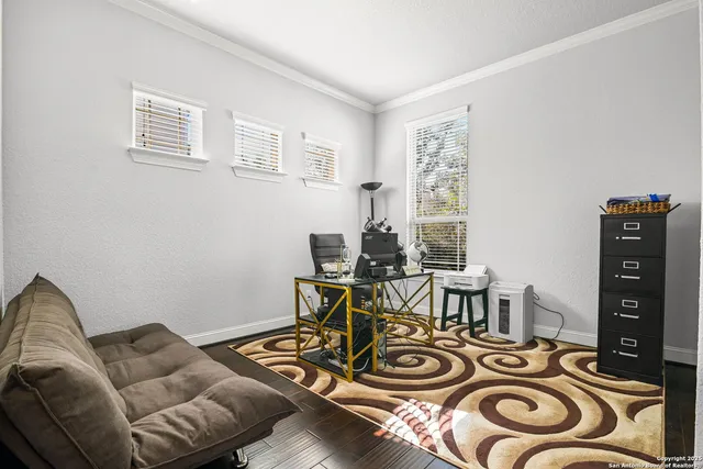 a view of a livingroom with furniture and a window