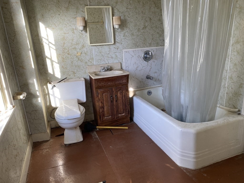 85 Main Street Groveland, MA 01834 - Photo 10 of 18 a bathroom with a sink a toilet and a bathtub