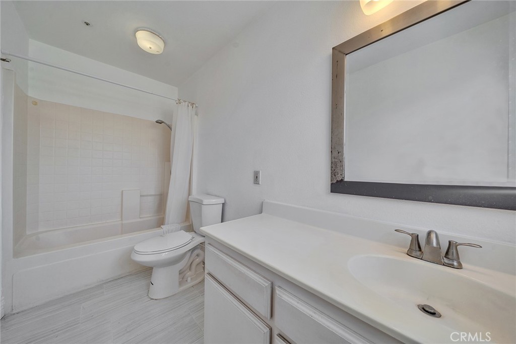 11320 Iris Lane El Monte, CA 91731 - Photo 13 of 14 a bathroom with a sink toilet and shower