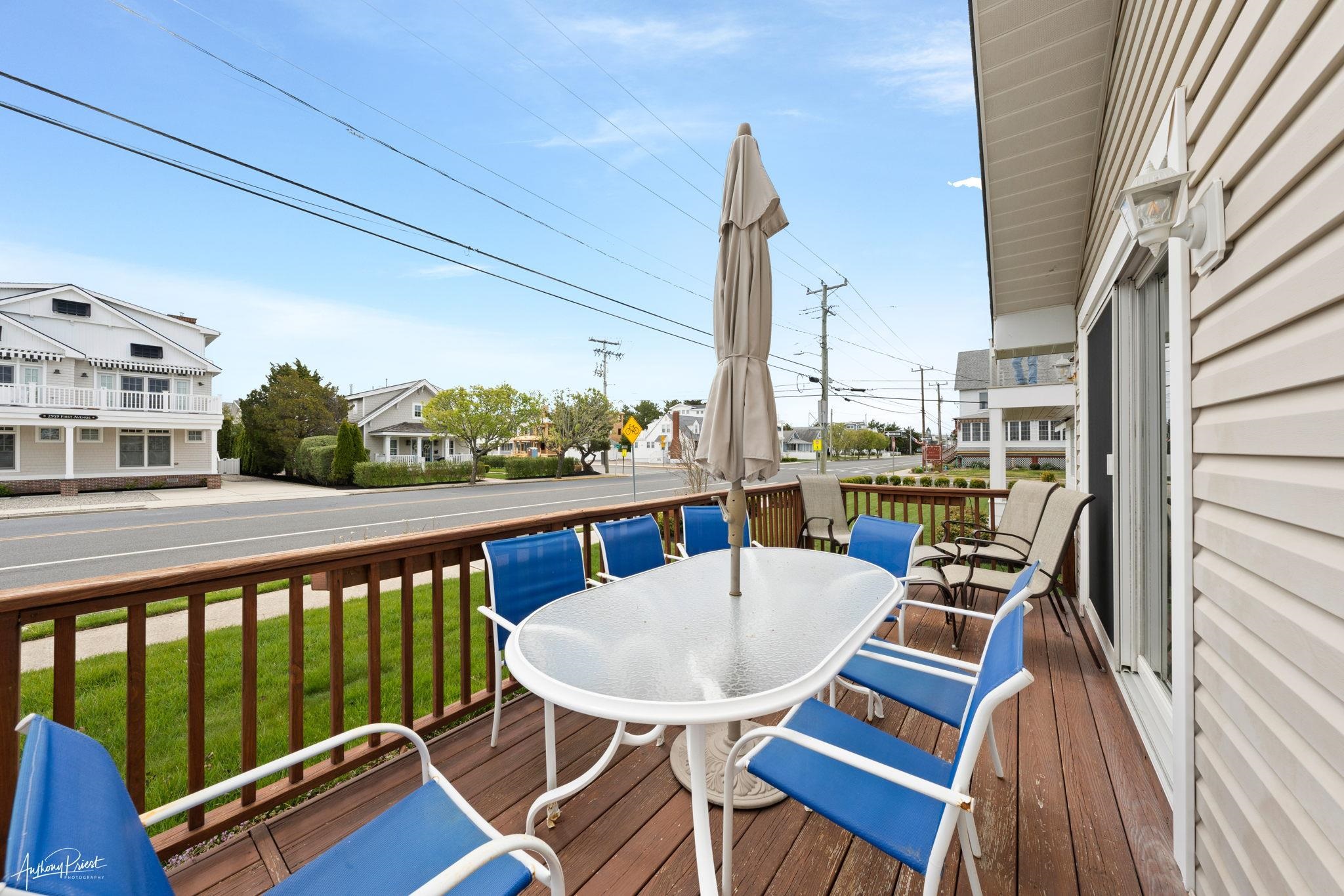 2968 First Avenue Avalon, NJ 08202 - Photo 19 of 23 a view of a balcony with table and chairs