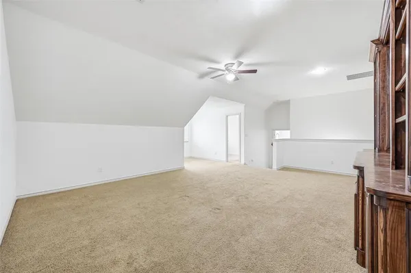 a view of an empty room with a fireplace
