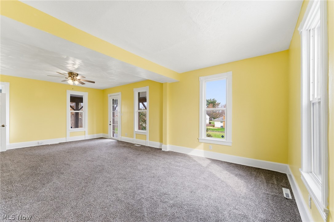 563 Geneva Avenue Struthers, OH 44471 - Photo 11 of 31 Spare room with carpet and a ceiling fan