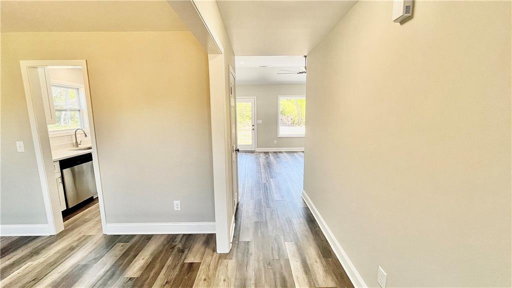 5 Green Road Griffin, GA 30224 - Photo 4 of 34 a view of a hallway with wooden floor and staircase