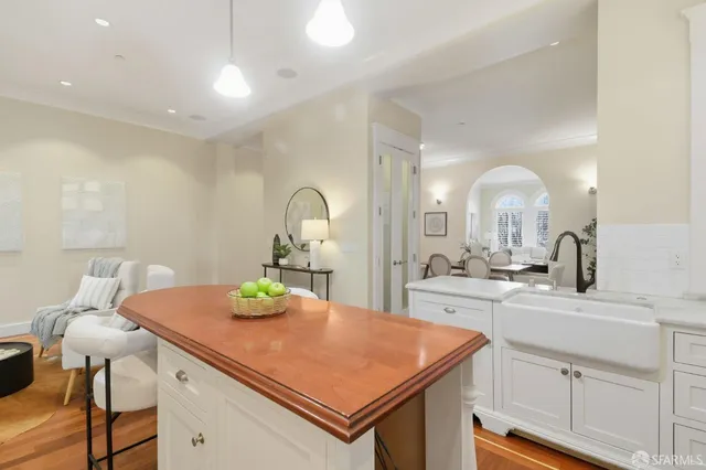 a view of a dining room with furniture and a potted plant