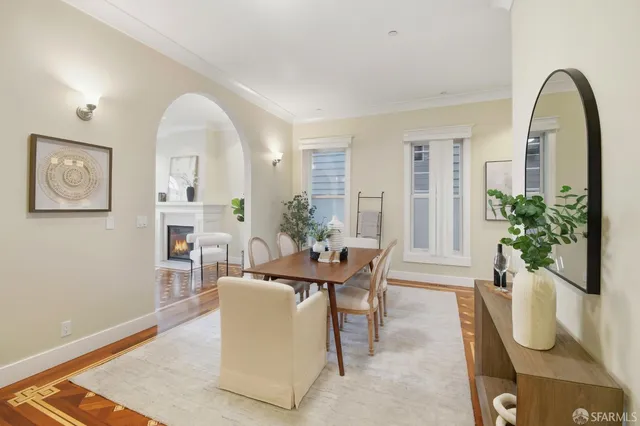 a bed room with a bed mirror and a window