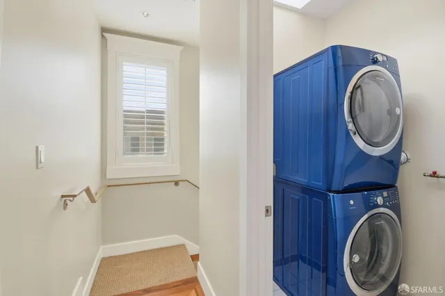 a spacious bedroom with a large bed and a large window