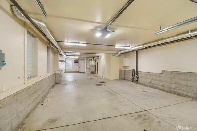 a view of a dining room with furniture and window