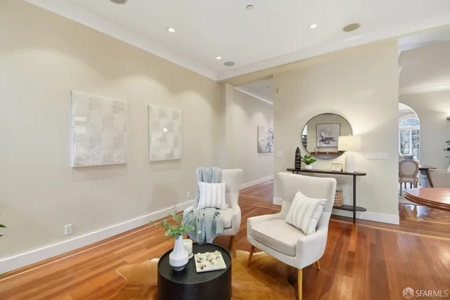 a kitchen with kitchen island granite countertop a sink cabinets and stainless steel appliances